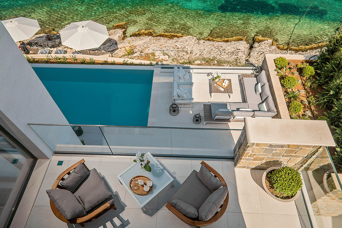 The view from above on the balcony and terrace pool with an acces to private beach.