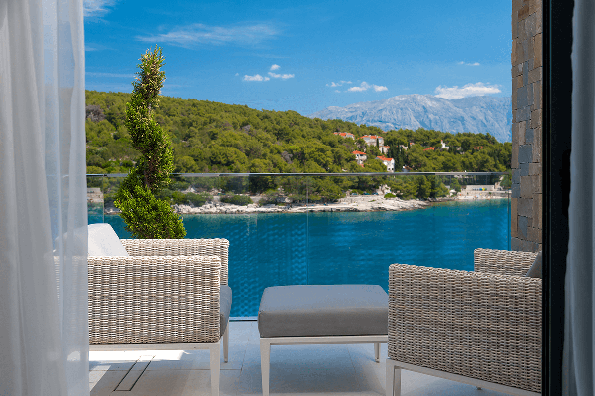 Balcony with a view on the nearby bay and clean blue sea.