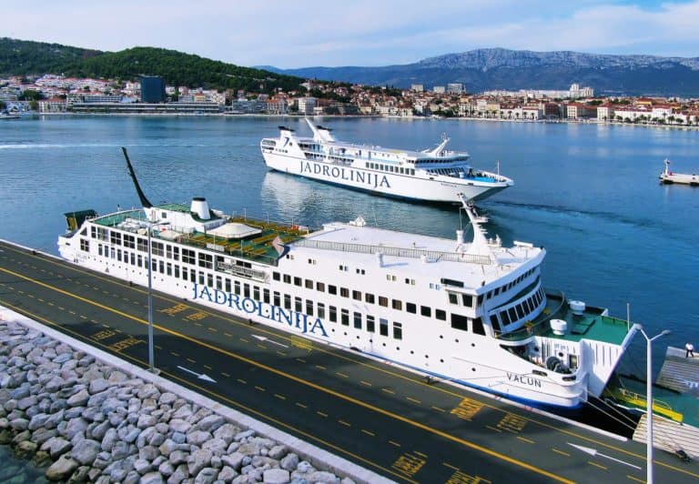 Two white ferries in the ferry port in the city of Split in Croatia.